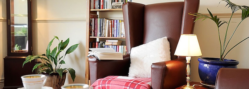 Armchair with open book in River Court lounge area